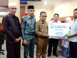 Pemerintah Aceh Jaya Bersama BPJS Serahkan JAMSOSTEK Santunan Kematian Bagi Keluarga THL dan Aparatur Gampong